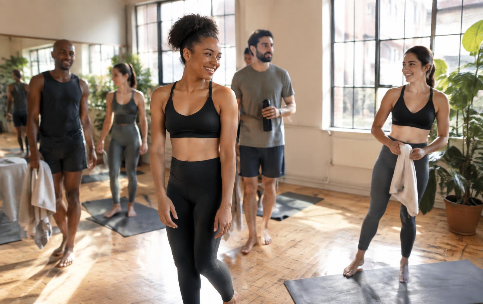 Adults gathering after a yoga class